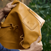 Crossback apron No. 63 made of cowhide in amber