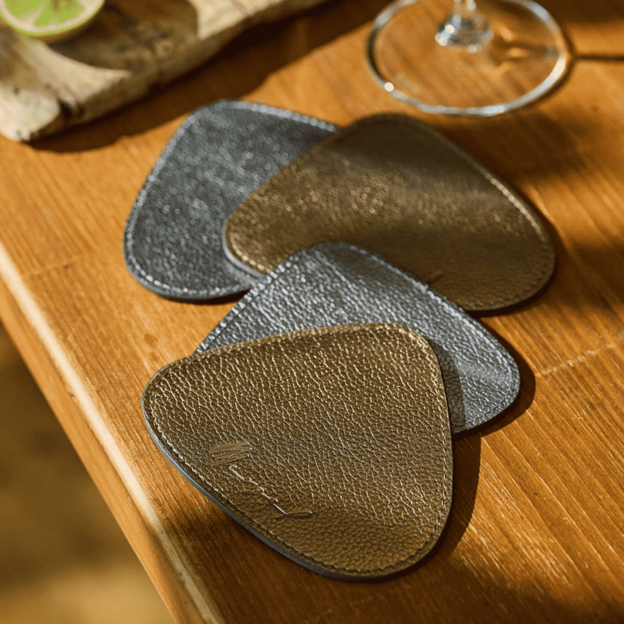 Triangular leather glass coasters in a set of 6, duo in bronze and silver