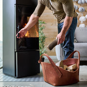 Leather firewood basket in cognac