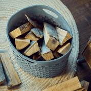 Woven firewood basket in blue-grey