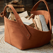 Leather firewood basket in cognac