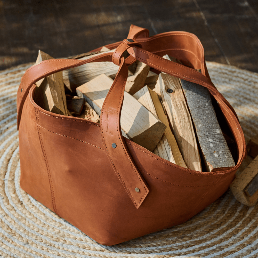 Leather firewood basket in cognac