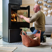 Leather firewood basket in cognac