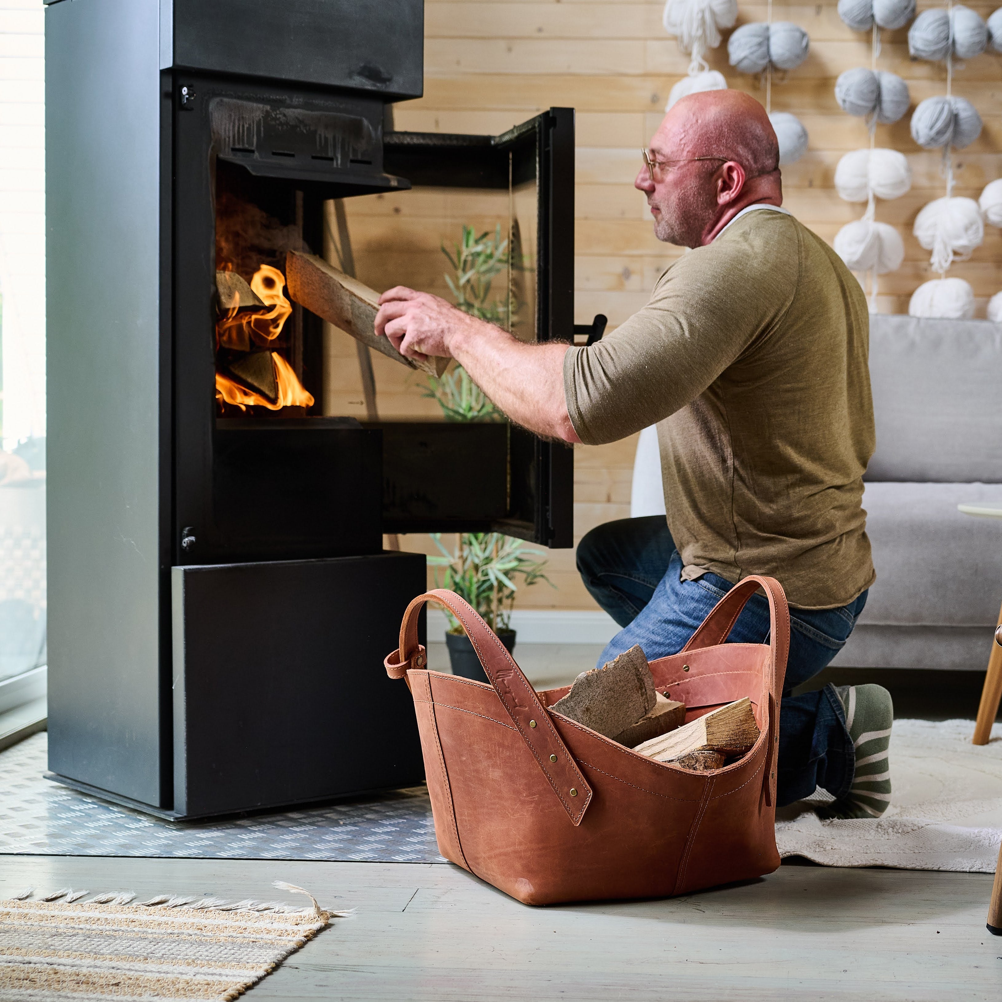 Leather firewood basket in cognac