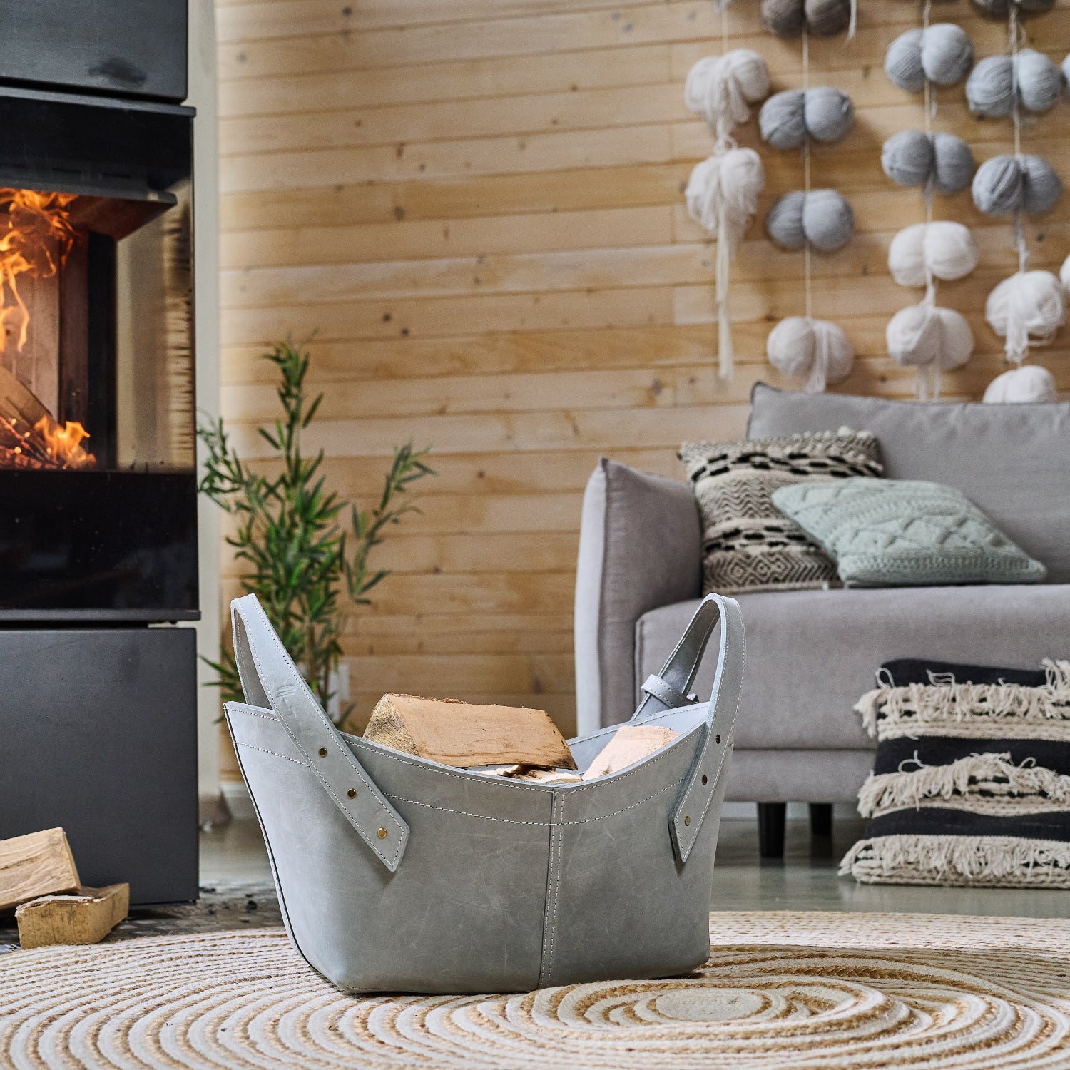 Leather firewood basket in cognac